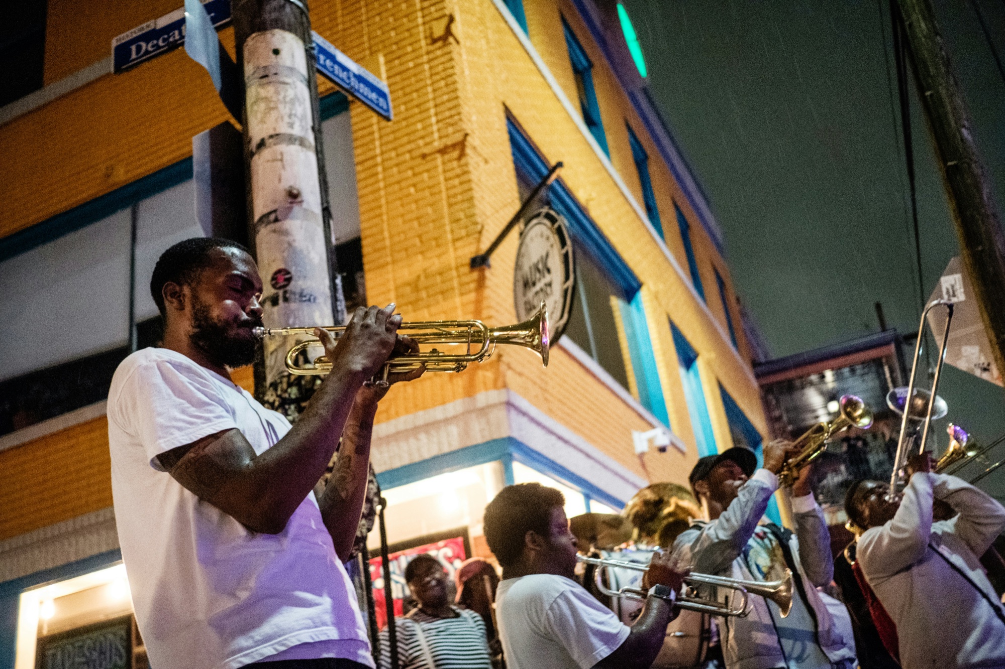 Brass musicians playing on Frenchmen Street in New Orleans at night