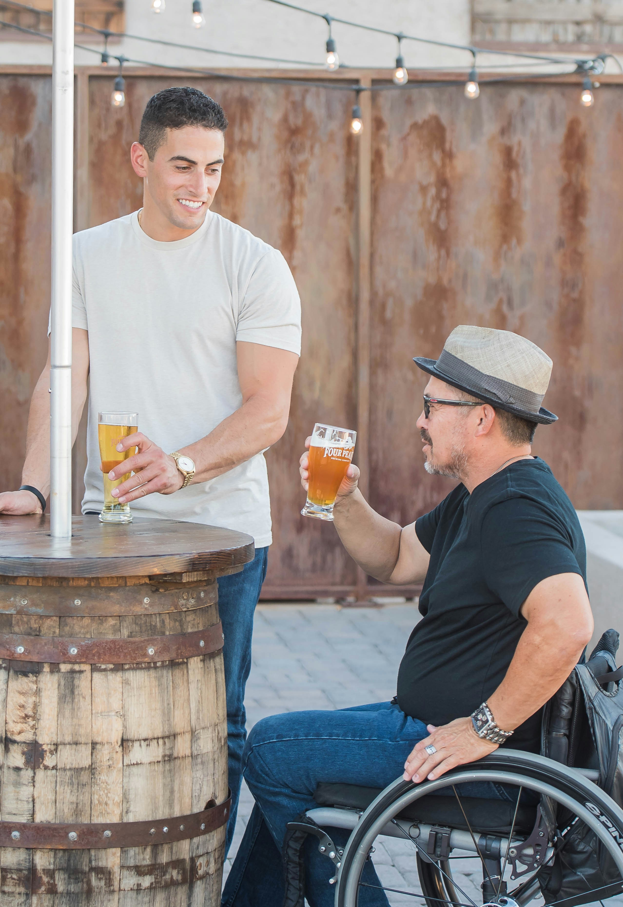 Friends enjoying a drink together outdoors