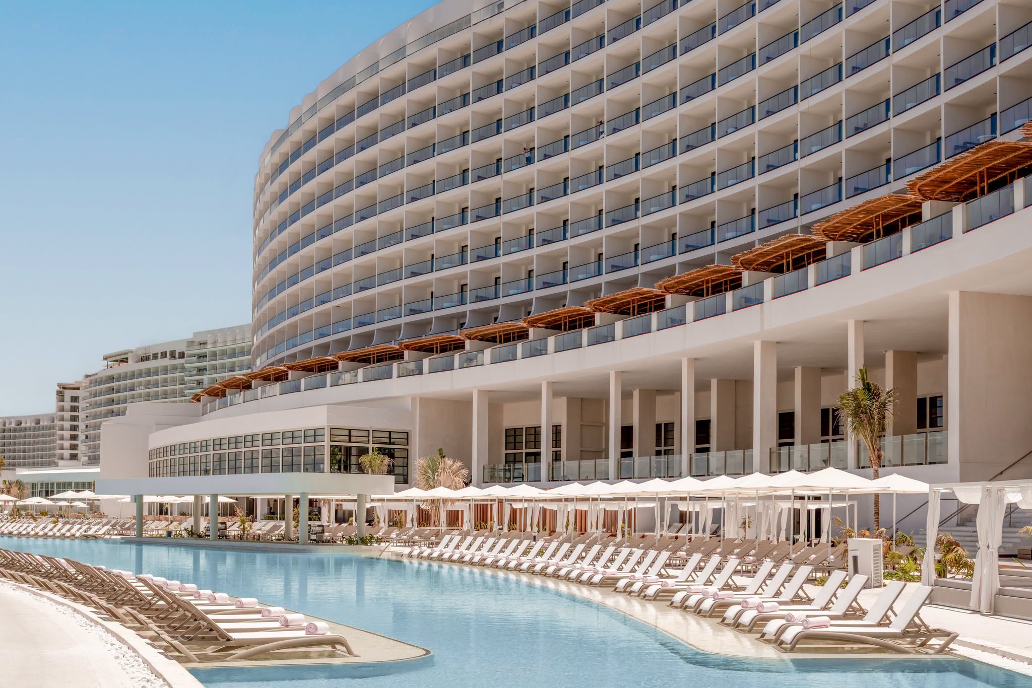 Pool and contemporary architecture at AVA Resort Cancun