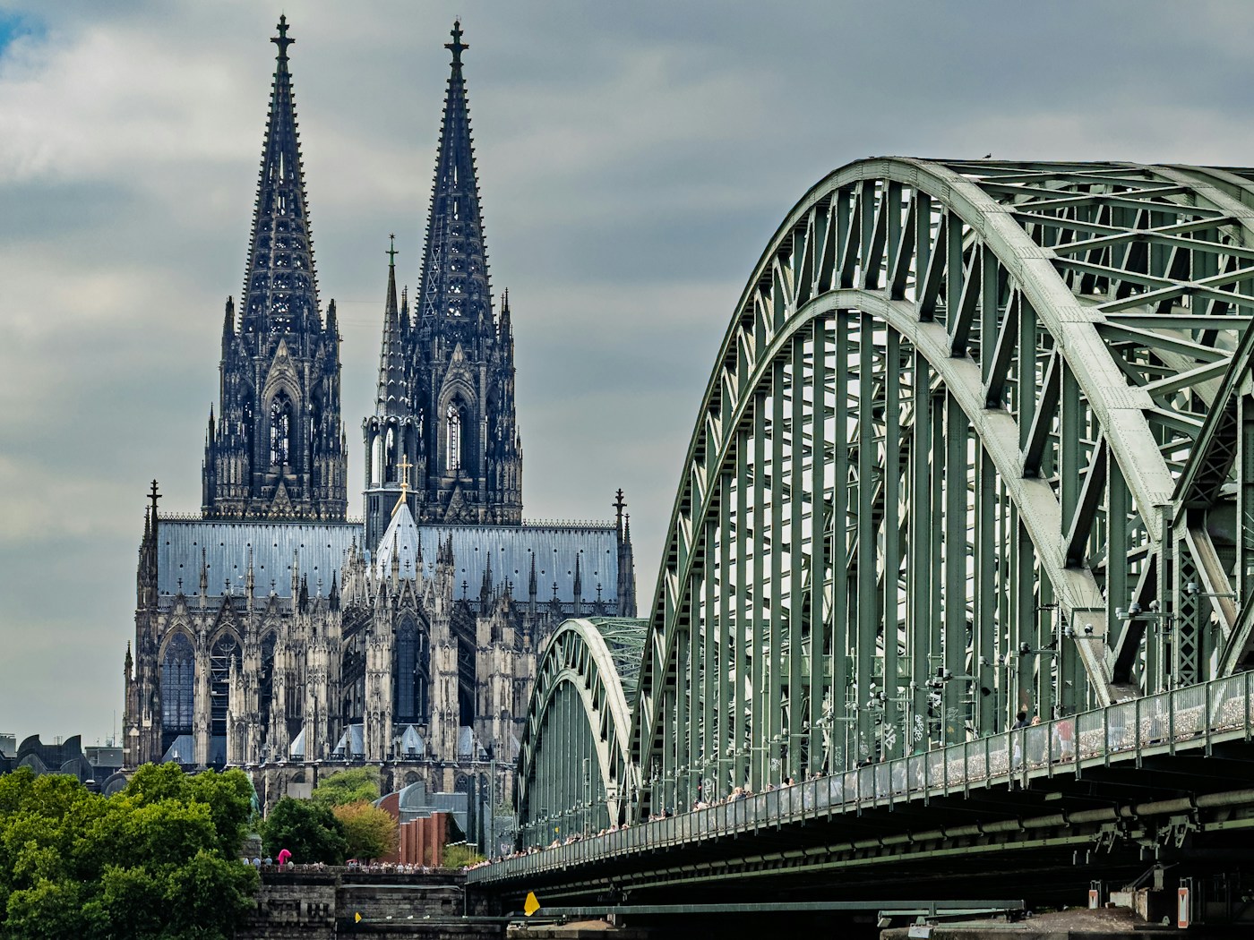 Cologne Cathedral and Hohenzollern Bridge beside the Rhine — destination photograph