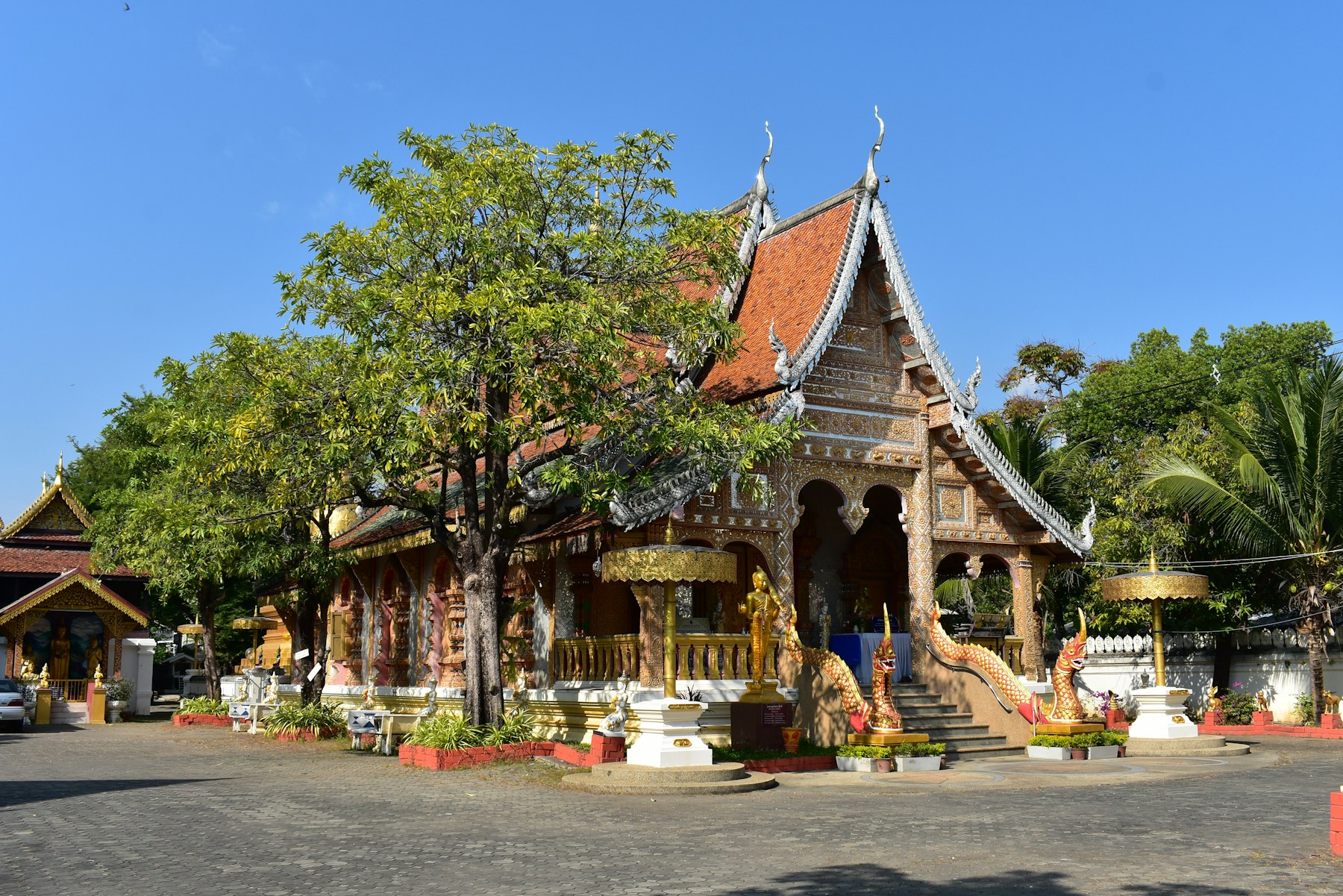 Ornate Buddhist temple beneath a blue sky in Chiang Mai